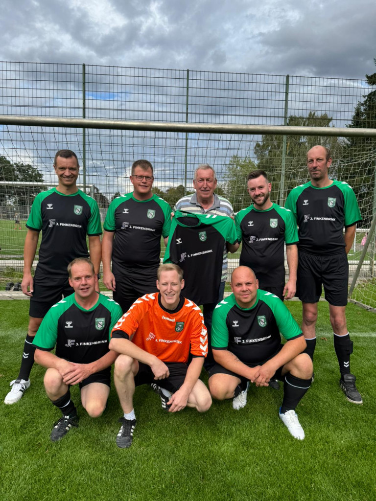 Teamfoto mit Sponsoren